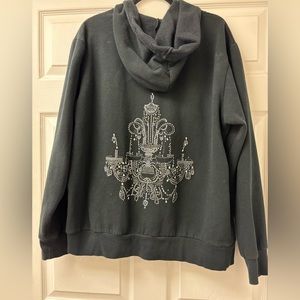 Women’s black hoodie with chandelier studded details.